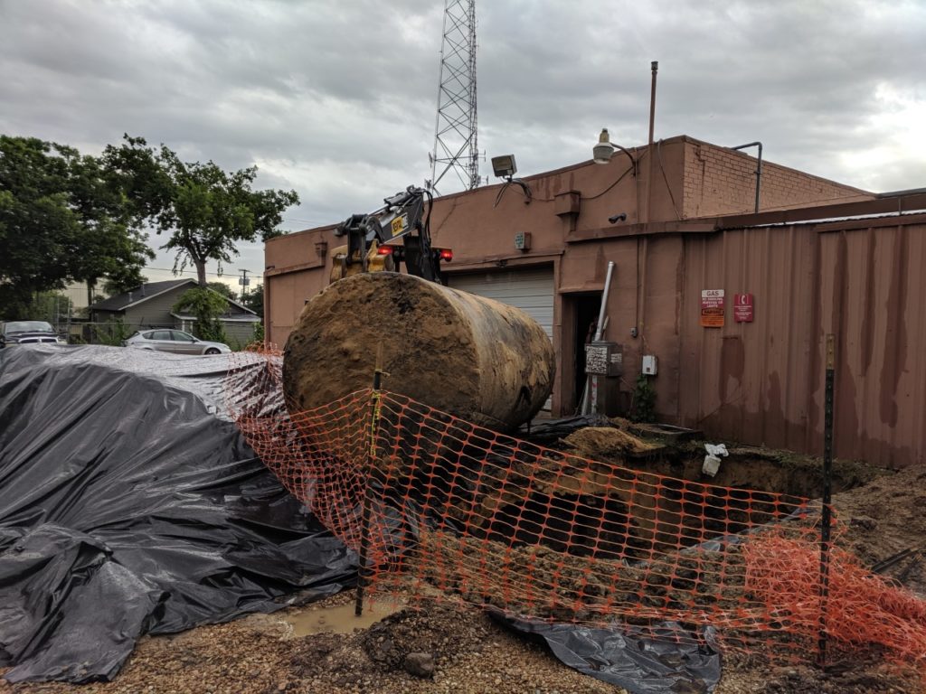 storage tank being pulled out of the ground